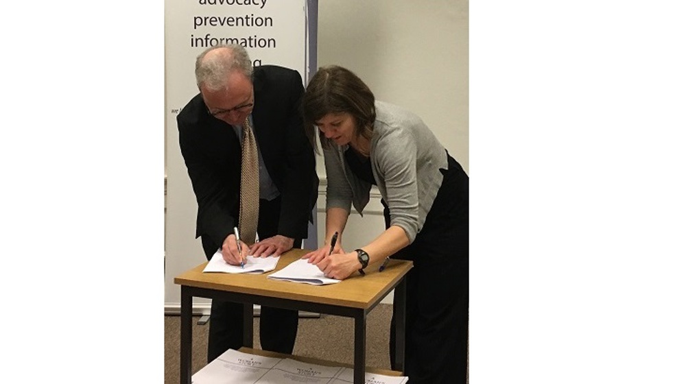 Lord Advocate James Wolffe and Sandy Brindley sign MOU